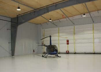 image of helicopter inside a global steel buildings helicopter hangers