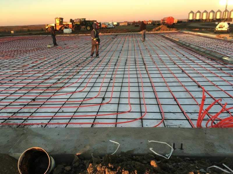 Laying the foundation of a heated floor in a steel barn
