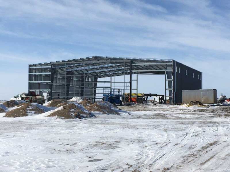 A Clearspan Pre-Engineered steel barn under construciton