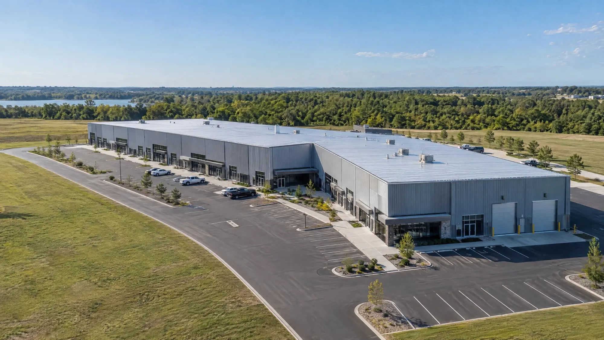 Aerial view of a commercial steel flex building with storefronts and parking